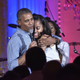 US President Barack Obama hugs his daughter Malia on her birthday during an Independence Day Celebration for military members and administration staff on July 4, 2016 in the East Room of the White House in Washington, D.C.
MANDEL NGAN/AFP/Getty Images